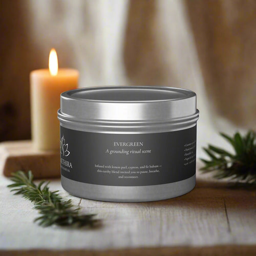 Silver candle tin with black label on a white background